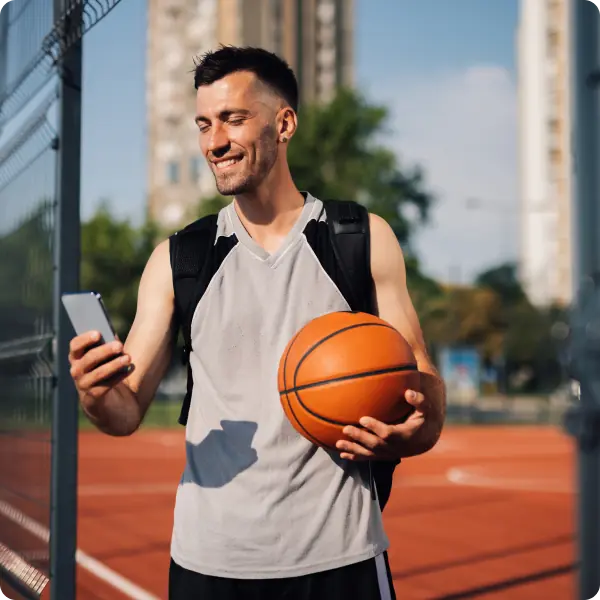 Parent booking a sports coach on phone
