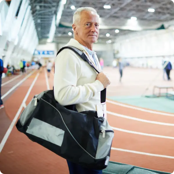 Coach holding clipboard