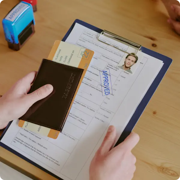 Coach holding trophy and soccer ball