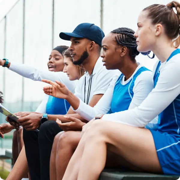 Coach holding clipboard