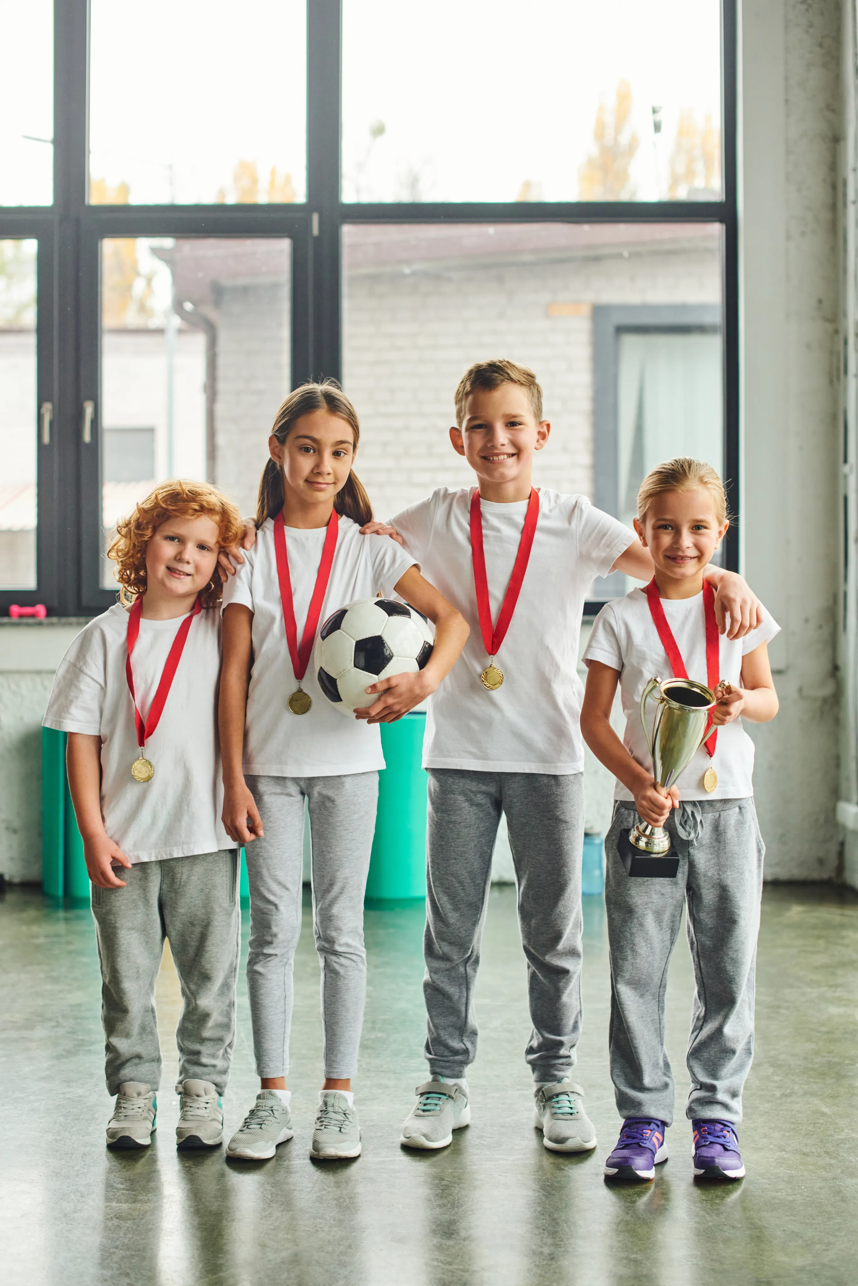 Young athletes celebrating together after a coaching session