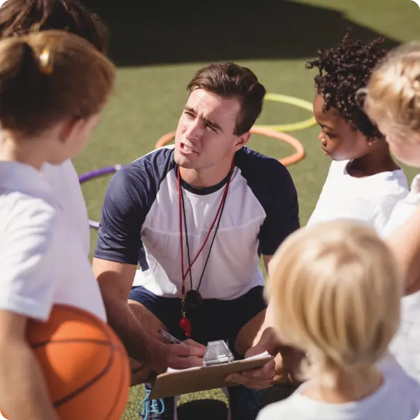 Family and coach connecting at a youth sports event